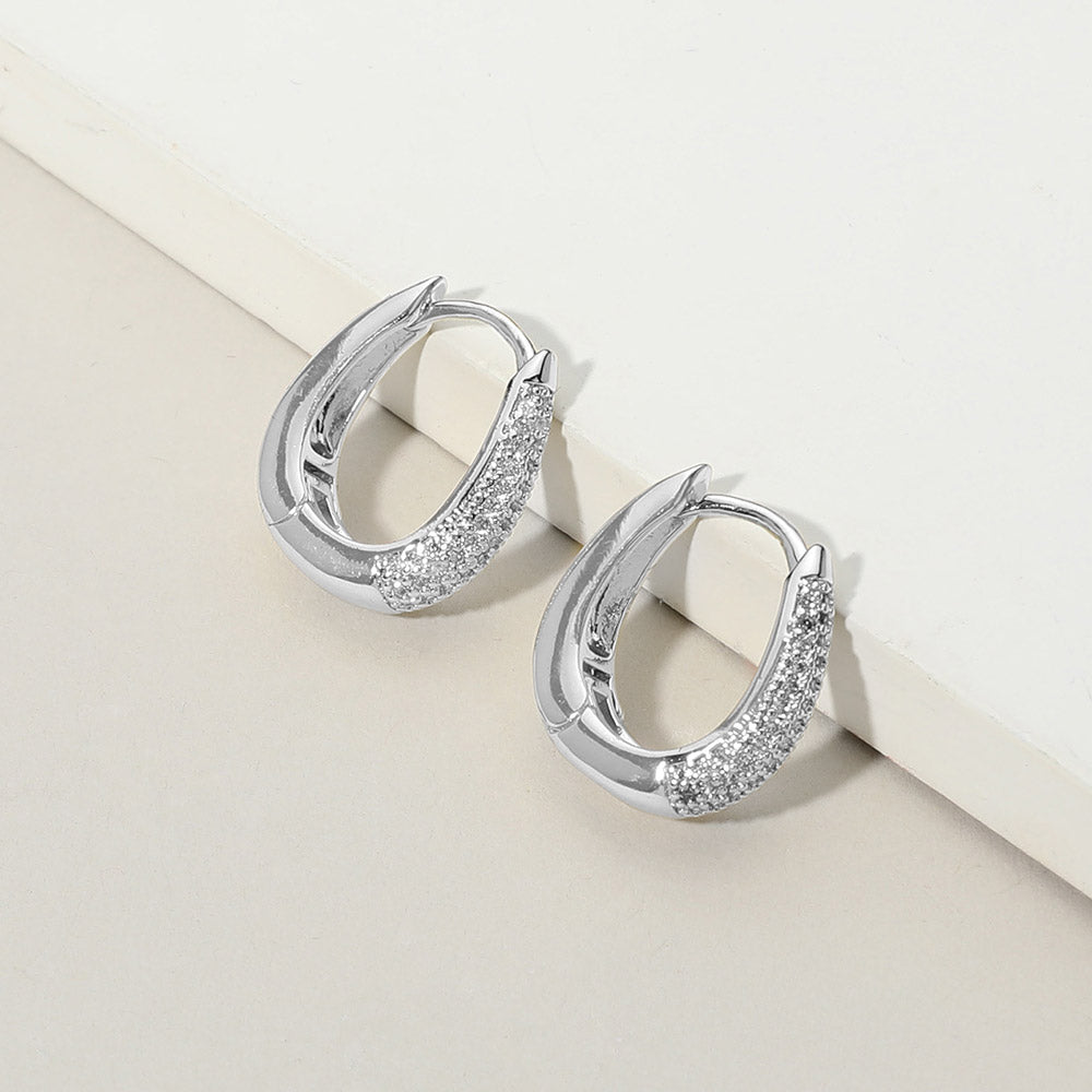 iLLASPARKZ White Gold Dipped CZ Stone Paved Oval Huggie Hoop Earrings