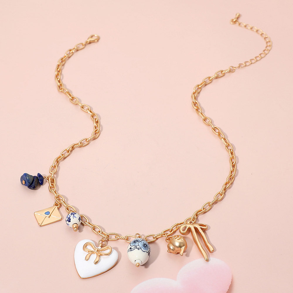 iLLASPARKZ Bow Heart Tea Party Charm Station Necklace