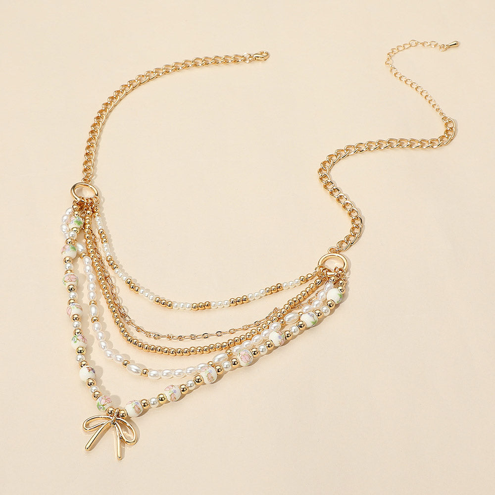 iLLASPARKZ Metal Bow Pendant Floral Ceramic Ball Pearl Beaded Multi Layered Necklace