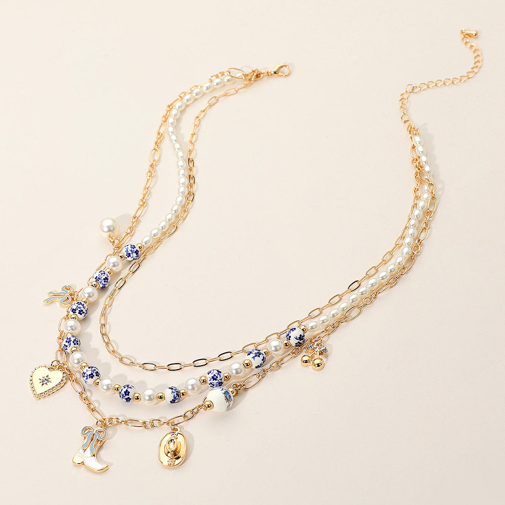 iLLASPARKZ Western Cowboy Boot Hat Bow Cherry Heart Charm Station Pearl Floral Ceramic Ball Beaded Layered Necklace